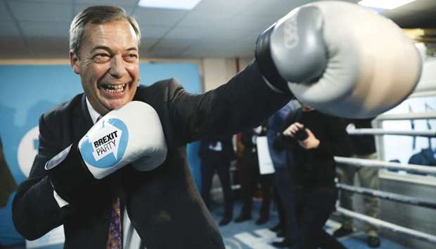 Brexit Party leader Nigel Farage wears boxing gloves during a visit at a boxing gym in Ilford, Britain, in this November 13, photograph.