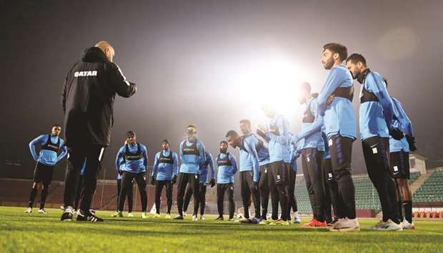 Qatar coach Felix Sanchez speaks to his players during a training session in Dushanbe yesterday.