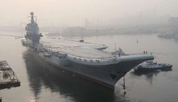 In this file photo taken on May 13, 2018, China's first domestically manufactured aircraft carrier, known only as ,Type 001A,, leaves port in the northeastern city of Dalian
