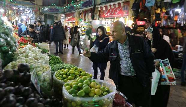 Iranians shop in the Tajrish Bazaar in the capital Tehran, yesterday.