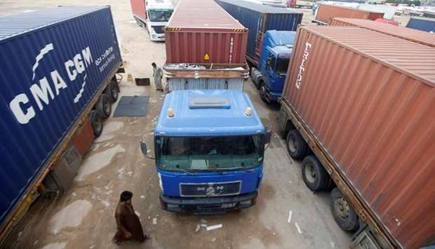 Trucks are jammed at the Umm Qasr port, as demonstrators block the entrance during the ongoing anti-government protests, south of Basra, Iraq yesterday.