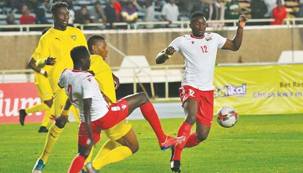 Kenyau2019s Victor Wanyama (right) and Stanley Okumu (second left) vie for the ball with Togou2019s Kodjo Laba (centre) during the African Cup of Nations (AFCON) qualifying match in Nairobi on Monday. (AFP)