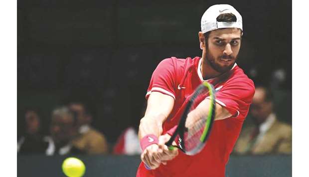 Russiau2019s Karen Khachanov returns the ball to Croatiau2019s Borna Coric during their singles match at the Davis Cup in Madrid on Monday. (AFP)