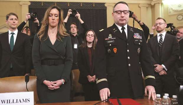 Jennifer Williams, a special adviser to Vice President Mike Pence for European and Russian affairs, and Lt Colonel Alexander Vindman, director for European Affairs at the National Security Council, stand before the House Intelligence Committee as they prepare to testify in a hearing that is part of the impeachment inquiry into US President Donald Trump on Capitol Hill in Washington.