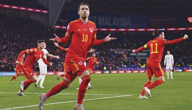 Walesu2019 midfielder Aaron Ramsey celebrates after scoring against Hungary during the Euro 2020 qualification match in Cardiff, Wales, on Tuesday night. (AFP)