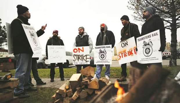 Teamsters Canada union workers picket at the Canadian National Railway Terminal in Brampton, Ontario.