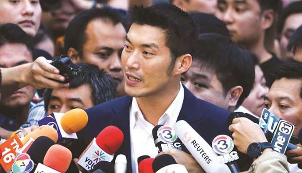 Future Forward Party leader Thanathorn Juangroongruangkit speaks to journalists after the constitutional court hearing in Bangkok yesterday.