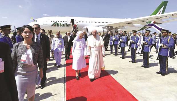 Pope Francis arrives at a military air terminal in Bangkok yesterday.