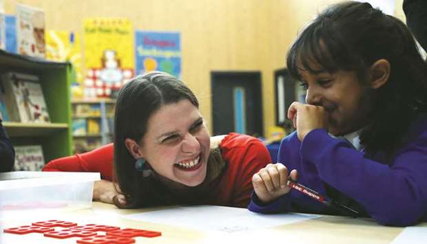 Liberal Democrat leader Jo Swinson visits the Trumpington Park Primary School in Cambridge, Britain, yesterday. Brexit is a u201cnational embarrassmentu201d and stopping it will free up u00a350bn to spend on public services, Swinson claimed yesterday.