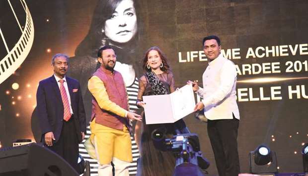Information and Broadcasting Minister Prakash Javadekar (left) and Goa Chief Minister Pramod Sawant present the Lifetime Achievement Award to French actress Isabelle Huppert at the opening ceremony of the 50th International Film Festival of India (IFFI) in Panaji yesterday.