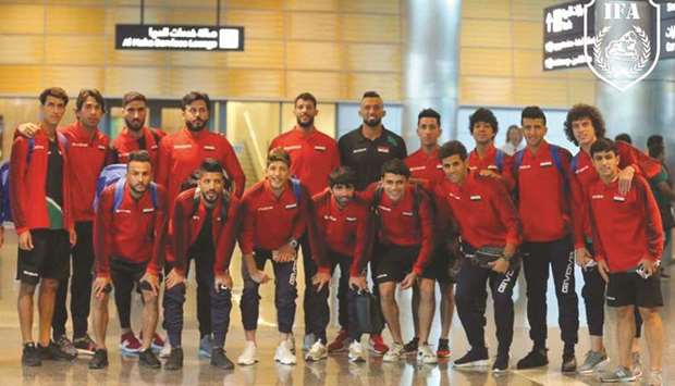 Iraq players pose after their arrival at the Hamad International Airport in Doha yesterday. The ambassador of Iraq to Qatar, Omar Ahmed Karim al-Barazanchi received the Iraqi contingent.