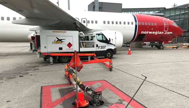 A Norwegian Air plane is refuelled at Oslo Gardermoen airport, Norway
