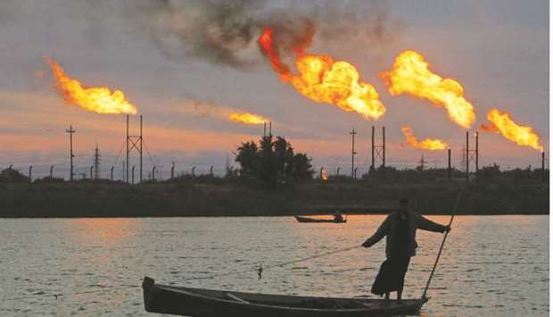 Flames emerge from flare stacks at the oil fields in Basra, Iraq (file).
