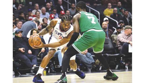 Los Angeles Clippers forward Kawhi Leonard controls the ball against Boston Celtics guard Jaylen Brown during the first half of their NBA game at Staples Center. PICTURE: USA TODAY Sports