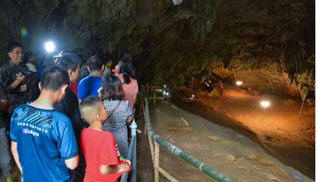 Chiang Rai Provincial Public Relations Office shows people visiting Tham Luang cave in the Mae Sai district of Thailand's northern Chiang Rai province