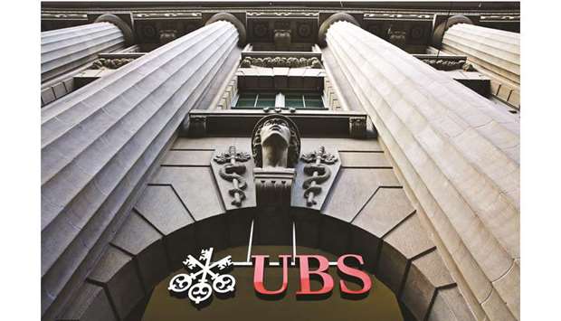 A sign hangs above the entrance to UBS headquarters in Zurich. UBS and Credit Suisse both increased their Brazil wealth  management staffs by more than 10% over the past year, and are hunting for more additions as demand surges for financial advice and new types of investments in the South American nation.