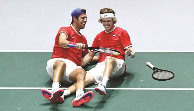 Russiau2019s Karen Khachanov (left) and Andrey Rublev celebrate after winning the quarter-final doubles match against Serbia at the Davis Cup Finals 2019 in Madrid, Spain, yesterday. (AFP)