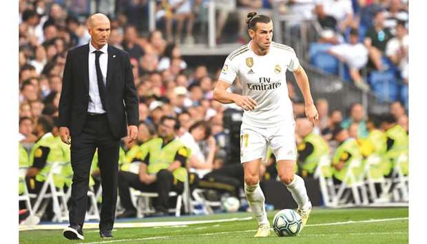 Real Madridu2019s French coach Zinedine Zidane (left) and forward Gareth Bale. (AFP)