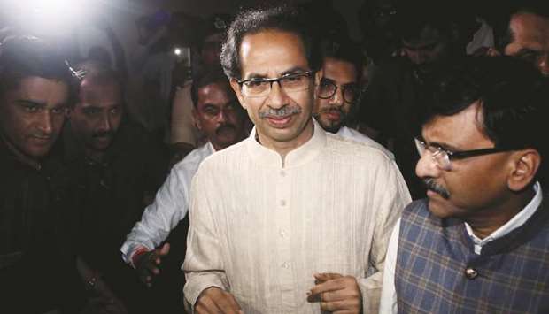 Shiv Sena chief Uddhav Thackeray leaves after a meeting with Nationalist Congress Party (NCP) and Congress party members in Mumbai yesterday.