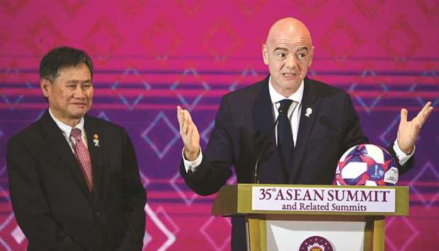 FIFA President Gianni Infantino (right) speaks during the Asean summit as Asean Secretary General Lim Jock Hoi looks on in Bangkok, Thailand, yesterday. (AFP)