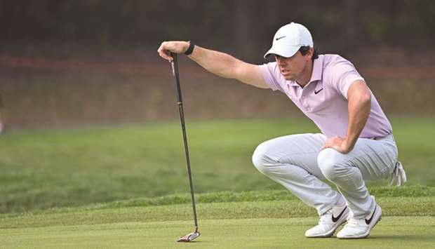 Rory McIlroy lines up a putt during the third round of the WGC-HSBC Champions in Shanghai yesterday. (AFP)