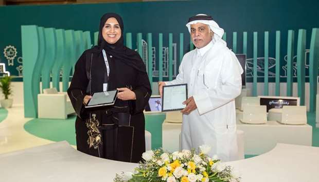 Ooredoo Qatar COO Yousuf Abdulla al-Kubaisi and Mada CEO Maha al-Mansouri after signing the agreement.