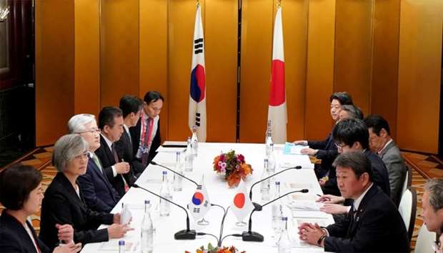 Japan's Foreign Minister Toshimitsu Motegi and South Korea's Foreign Minister Kang Kyung-wha attend a bilateral meeting before the G20 foreign ministers meeting in Nagoya, Japan