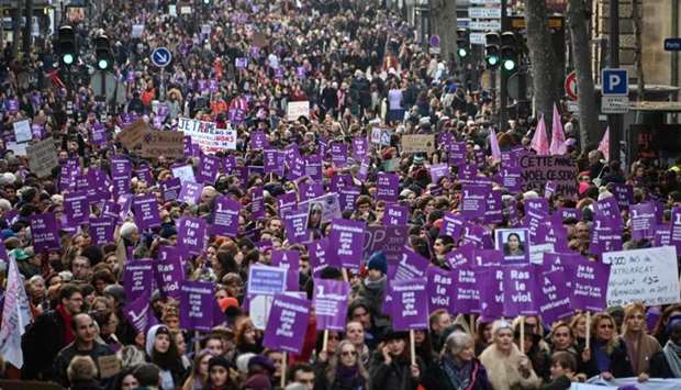 People take part in a protest to condemn violence against women in Paris