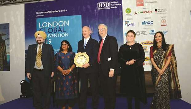 Richard Holt Whiting, chief representative of Doha Bank Representative Office, London, accepting the award from Alok Sharma, Secretary of State for International Development, the Government of UK, and MP, Reading West, during the event.