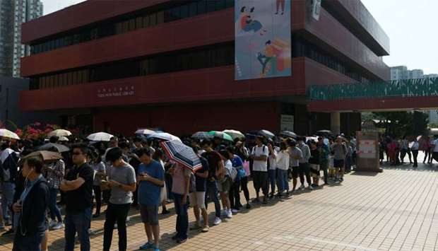 People queue to cast their vote during the district council elections in Tuen Mun district of Hong Kong