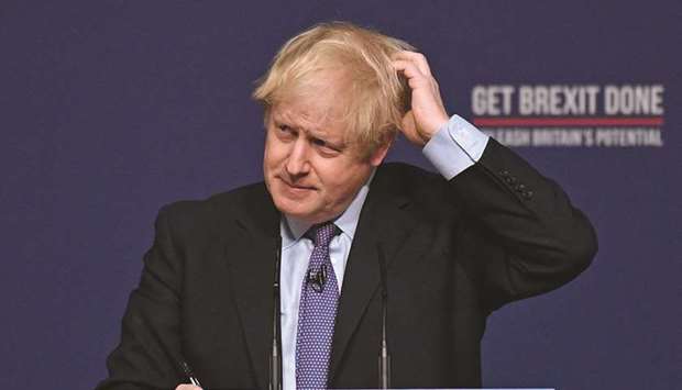 Prime Minister Boris Johnson gestures as he answers questions from members of the media during an event to launch the 2019 Conservative Party general election manifesto in Telford yesterday.