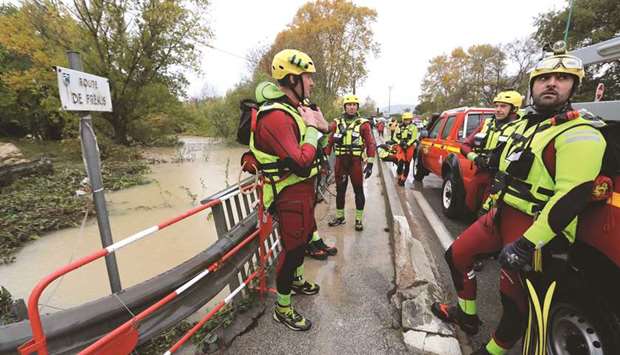 Members of the French civil defence take part in rescue operations in flooded areas following heavy rains in Le Muy, southeastern France.