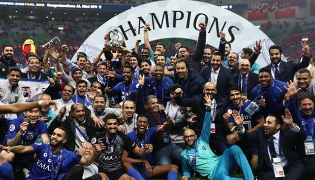 Members of Al-Hilal celebrate their victory and Asian club title