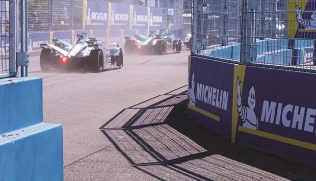 Electric vehicles travel along a racetrack during the ABB FIA Formula E Championship in the Brooklyn borough of New York on July 13. Breakthroughs made by competitors in Formula E, which began its sixth season last week, are being incorporated into family SUVs and sedans u2013 and even Indiau2019s electric rickshaws u2013 as manufacturers seek to improve and extend their electric lineups while nations gradually phase out gas guzzlers. More powerful batteries and better motors, energy management software and braking systems are all being transferred from the racetrack to the showroom.