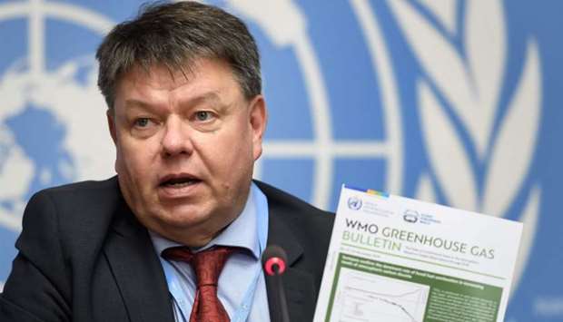 World Meteorological Organization (WMO) secretary-general Petteri Taalas shows the latest WMO Greenhouse Gas Bulletin during a press conference for the publishing of the annual Greenhouse Gas Bulletin on atmospheric concentrations of CO2