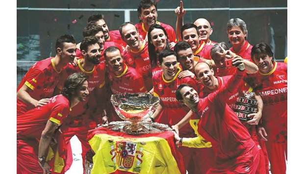Spainu2019s Rafael Nadal (foreground, right) takes a selfie with his teammates and the winneru2019s trophy after beating Canada in the Davis Cup Finals 2019 in Madrid, Spain, on Sunday. (AFP)