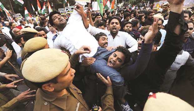 Supporters of the Congress party shout slogans as they are stopped by police during a protest against the formation of a Bharatiya Janata Party (BJP)-led coalition government in Maharashtra, in New Delhi yesterday.