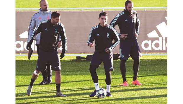 Juventusu2019 forward Cristiano Ronaldo (centre) attends a training session at the Continassa Training Ground in Turin, Italy, yesterday. (Reuters)