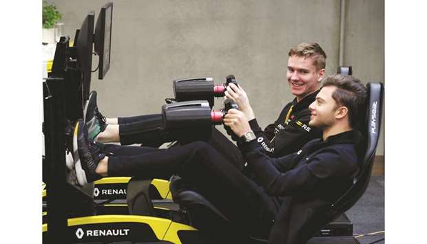 Jarno Opmeer (left), F1 esports driver for Renault Sport Team Vitality, and Max Fewtrell, Renault Sport Academy driver at the Renault F1 Esports Facility Tour in Enstone, United Kingdom, on Monday. (Reuters)
