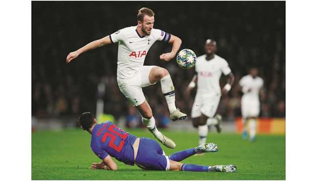 Tottenham Hotspuru2019s English striker Harry Kane (top) vies with  Olympiakosu2019 Tunisian defender Yassine Meriah during the Champions League group B match at the Tottenham Hotspur Stadium in north London, on Tuesday. (Reuters)