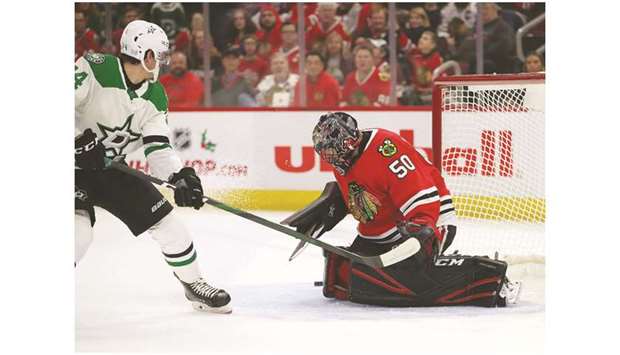 Corey Crawford of the Chicago Blackhawks makes a save against Denis Gurianov of the Dallas Stars at the United Center in Chicago. (Getty Images/AFP)