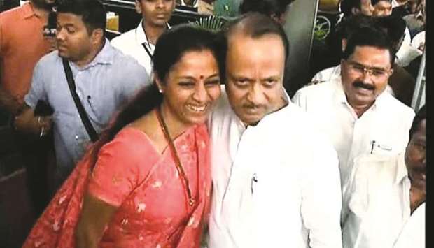 Nationalist Congress Party MP Supriya Sule hugs her cousin Ajit Pawar outside the Maharashtra assembly in Mumbai yesterday.