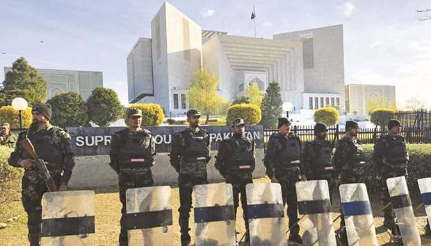 Paramilitary soldiers stand guard outside the Supreme Court building in Islamabad.