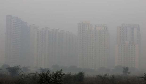 Buildings are engulfed in fog in Noida on the outskirts of New Delhi