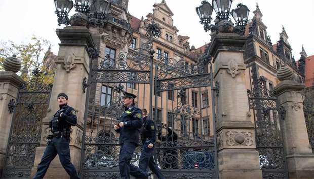 Policemen leave the Residenzschloss Royal Palace that houses the historic Green Vault (Gruenes Gewoelbe) in Dresden, eastern Germany