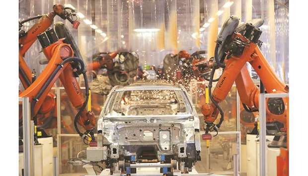 Robotic arms manufactured by Kuka operate a car chassis on the automated welding production line inside the VW factory in Emden, Germany. The 2016 takeover of Kuka by Chinese household goods maker Midea had sparked an outcry with critics saying vital technologies were being sold off to Beijing.