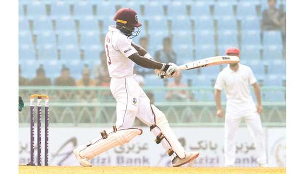 West Indiesu2019 Shamarh Brooks plays a shot during the second day of the only cricket Test match against Afghanistan at the Ekana Cricket Stadium in Lucknow, India, yesterday. (AFP)