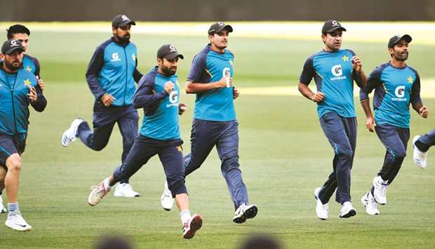 Pakistanu2019s Mohamed Abbas (right) and teammates take part in a training session on the eve of the second cricket Test against Australia in Adelaide yesterday. (AFP)