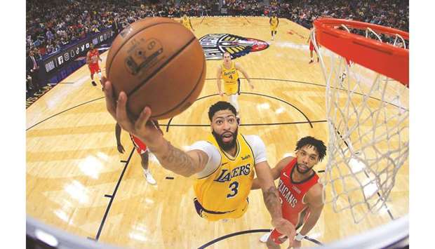 Anthony Davis of the Los Angeles Lakers shoots the ball over Jahlil Okafor of the New Orleans Pelicans at Smoothie King Center in New Orleans, Louisiana. (Getty Images/AFP)
