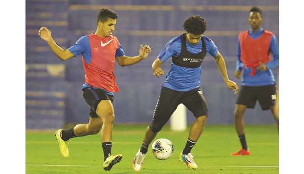 Qatar players take part in a training session on the eve of their match against Yemen in Doha.